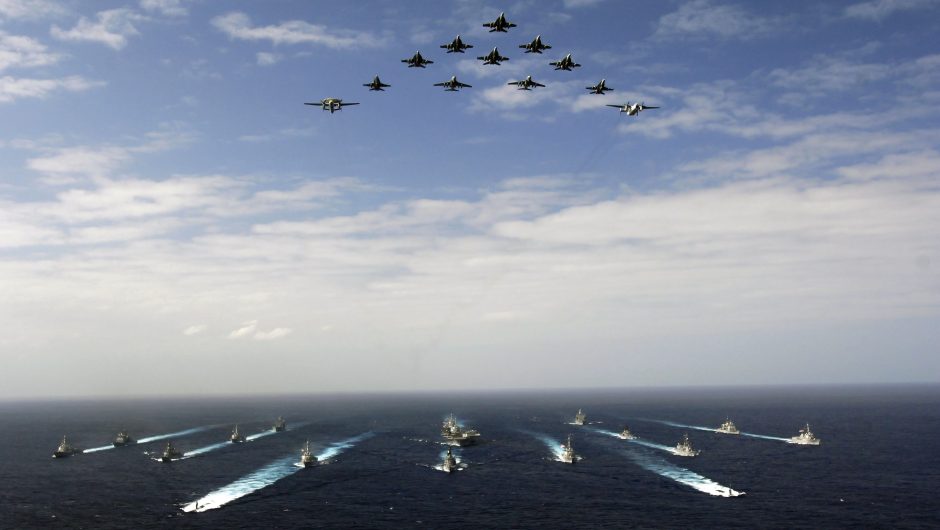 Pacific Ocean (November 14, 2006) - Aircraft assigned to Carrier Air Wing Five (CVW-5) fly over a group of 18 U.S. and Japanese Maritime Self-Defense Force ships, at the conclusion the two nations' exercise ANNUALEX.